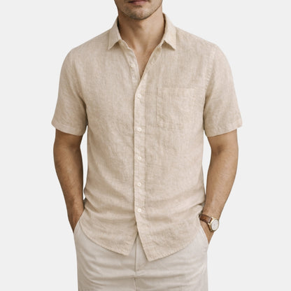 Man wearing a khaki linen shirt and pants on a white background