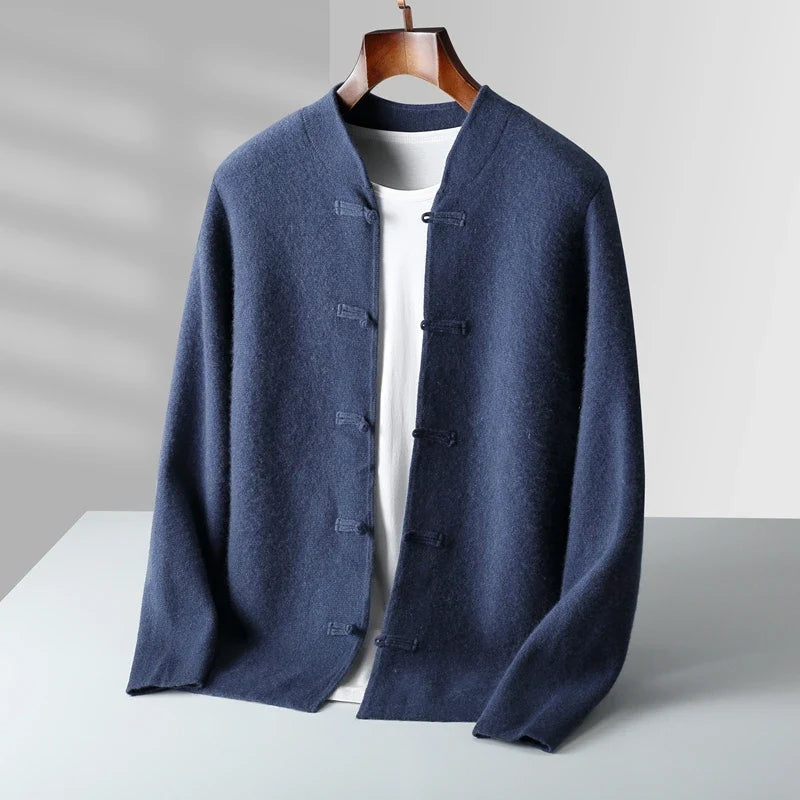 Blue cardigan on a mannequin against a gray background