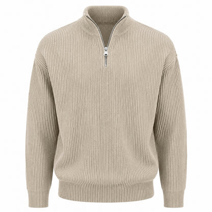 A beige ribbed knit quarter-zip sweater with a stand collar and a silver zipper, shown on a plain white background.