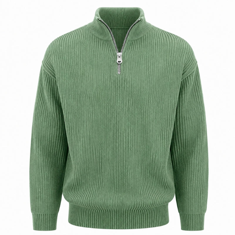 A sage green ribbed knit quarter-zip sweater with a stand collar and silver zipper, shown on a plain white background.