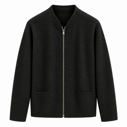 A black zip-up jacket with a stand collar, long sleeves, and two front patch pockets, shown against a plain white background.