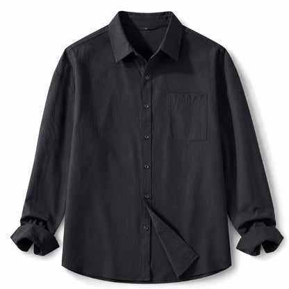 A black long-sleeve button-up shirt with a chest pocket, displayed on a clean white background.