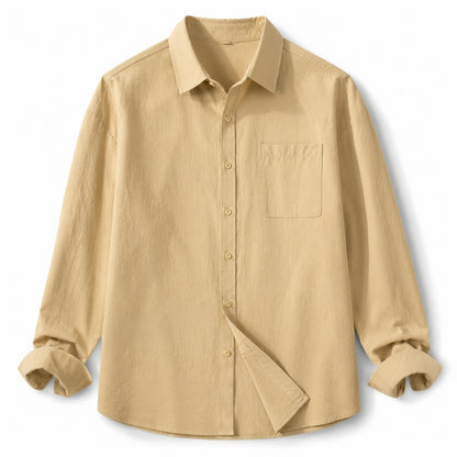 A light beige long-sleeve button-up shirt with a chest pocket, shown flat against a white background.