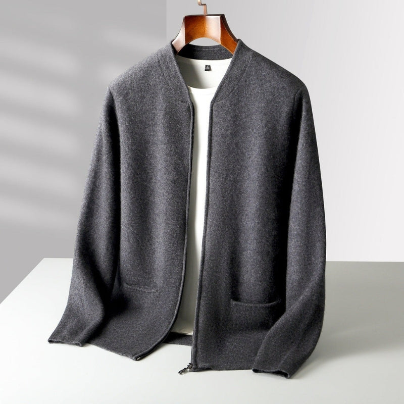 A dark gray open-front knit cardigan with a stand collar, long sleeves, and front patch pockets, displayed on a wooden hanger over a white shirt against a light gray background.