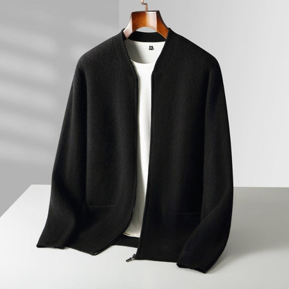A black open-front knit cardigan or lightweight jacket displayed on a wooden hanger over a white top, set against a clean light gray studio background with soft shadowing.