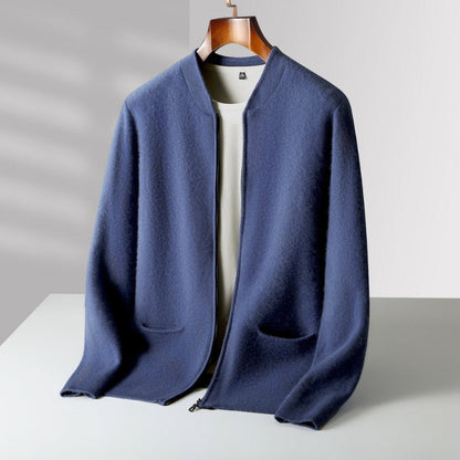 A navy blue open-front cardigan sweater with a stand collar, displayed on a wooden hanger over a white t-shirt against a light gray background.