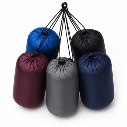 Five cylindrical drawstring storage bags in blue, black, burgundy, gray, and navy, arranged in a cluster on a white background.