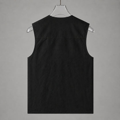 A black sleeveless vest displayed from the back on a clear plastic hanger against a solid gray background.