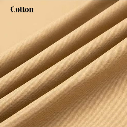 Close-up of draped beige cotton fabric with soft folds and the word 'Cotton' in the top left corner.