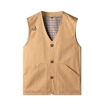 A tan canvas utility vest with a V-neck, three button closures, and two large front patch pockets, shown flat on a white background.
