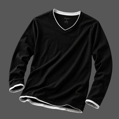 A black long-sleeve V-neck t-shirt with white contrast trim along the collar, cuffs, and hem, displayed on a dark gray background.