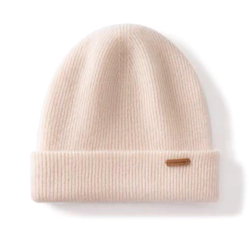 Beige knit beanie with a brand logo on a white background