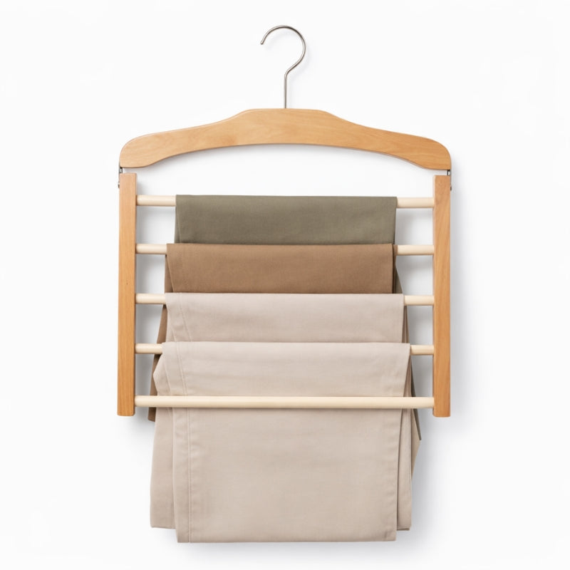 Wooden hanger with multiple shelves holding folded pants on a white background