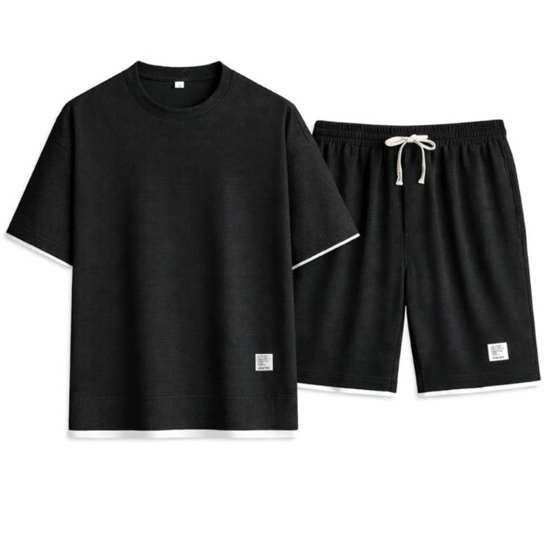 Black t-shirt and shorts set on a white background