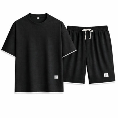 Black t-shirt and shorts set on a white background