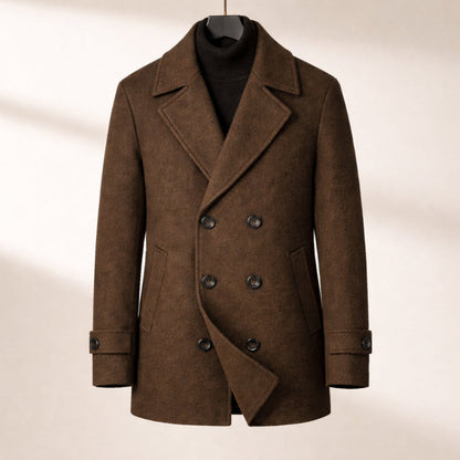 Brown coat on a hanger against a beige background