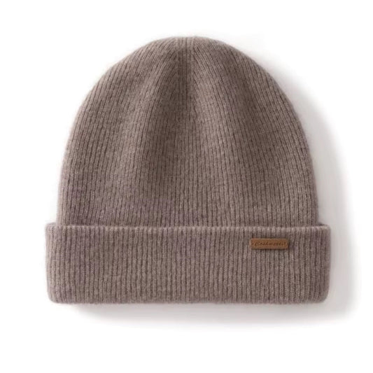 Gray knit beanie with a brand label on a white background