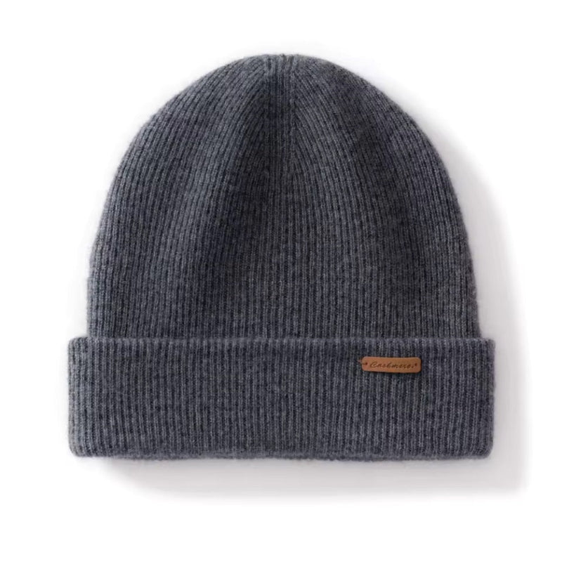Dark Gray knit beanie with a brand label on a white background