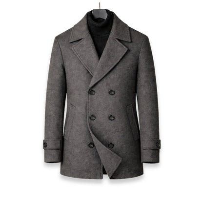 Gray peacoat on a hanger against a white background