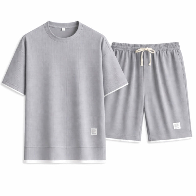 Gray pajama set with shorts on a white background