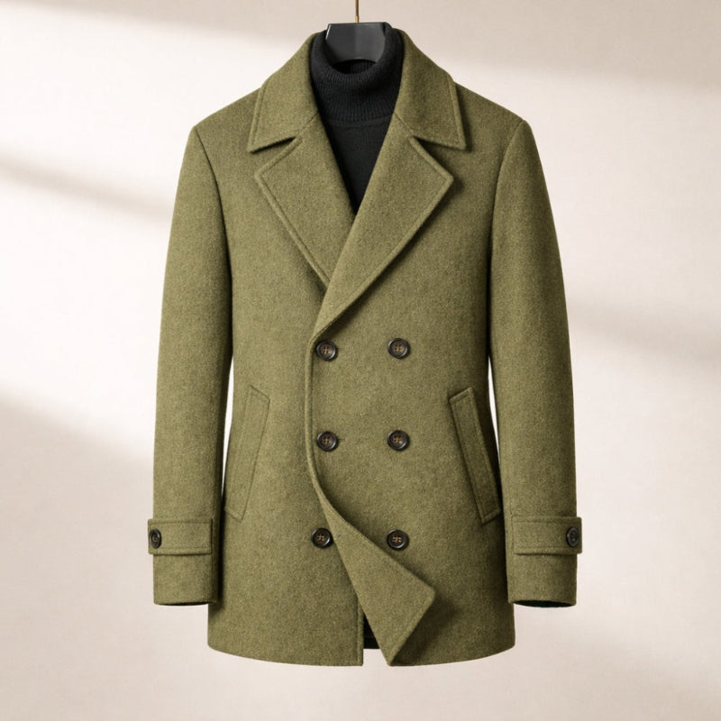 Green peacoat on a hanger against a neutral background