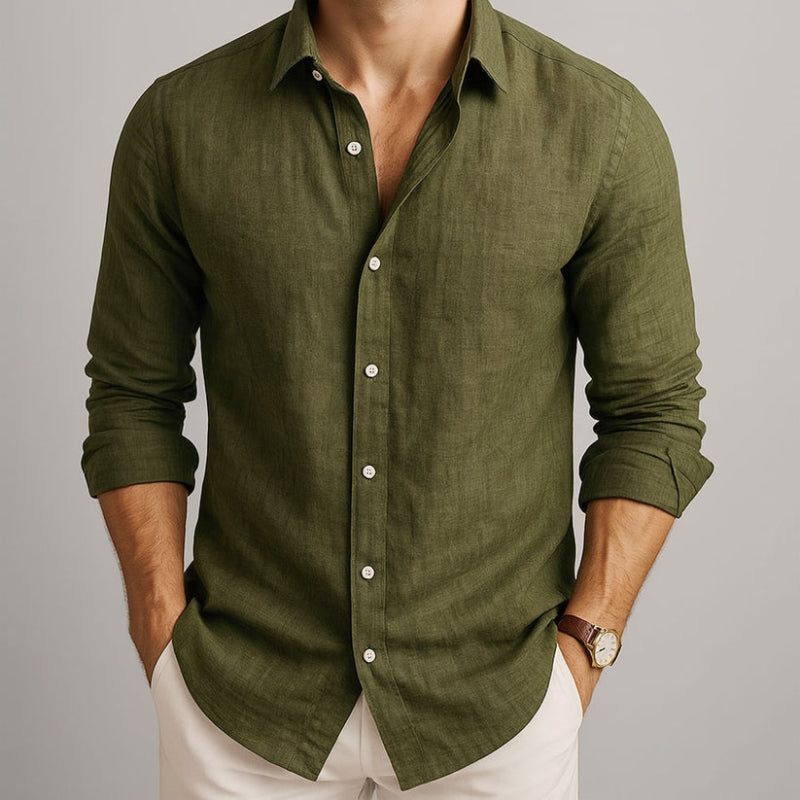 Green button-up shirt worn by a person on a gray background