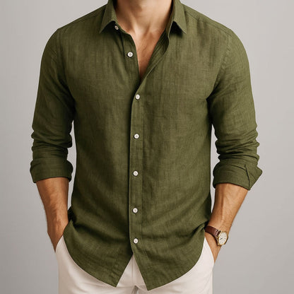Green button-up shirt worn by a person on a gray background