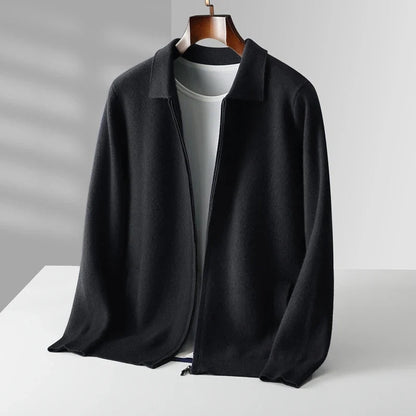 Black jacket on a white surface with a gray background