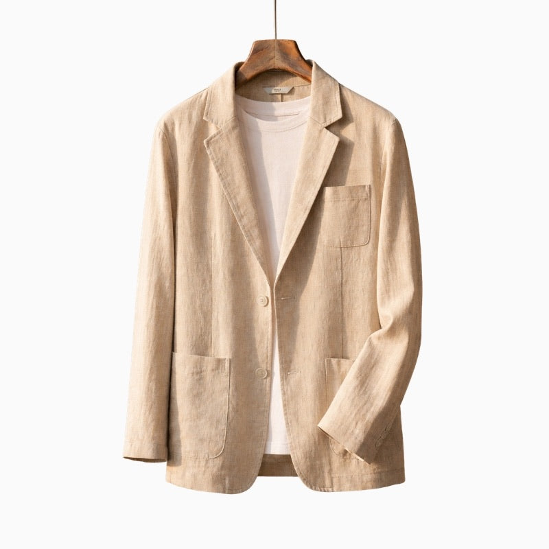 Beige blazer on a hanger against a white background
