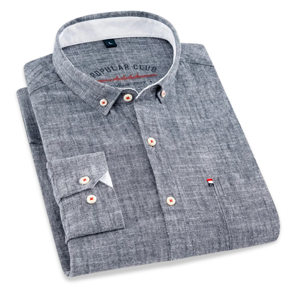 Folded gray shirt with brand logo on a white background