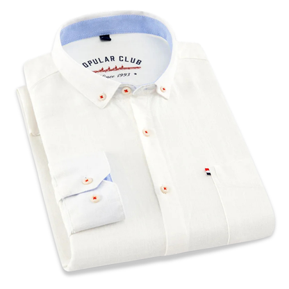 Folded white dress shirt with blue collar and 'Opular Club' label on a white background