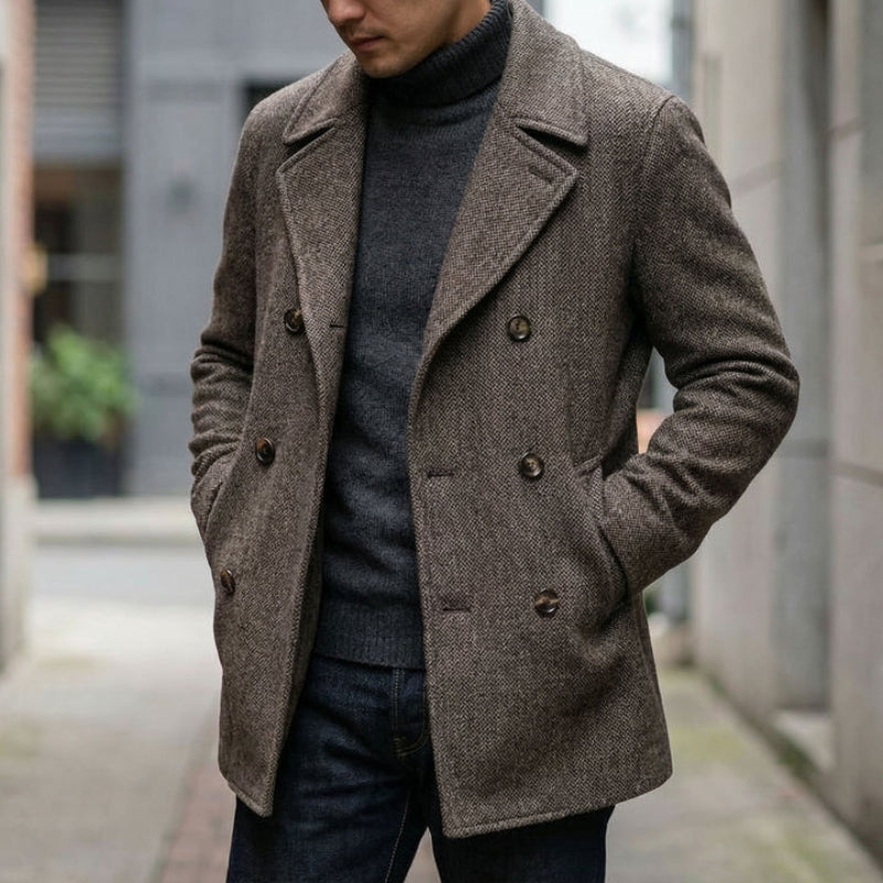 Man wearing a brown peacoat in an urban setting