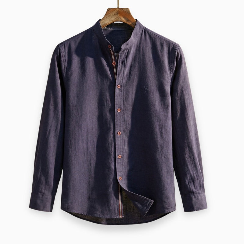 Navy blue button-up shirt on a wooden hanger against a white background
