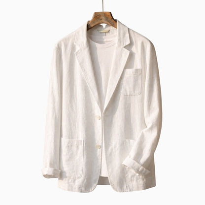 White linen blazer on a wooden hanger against a white background