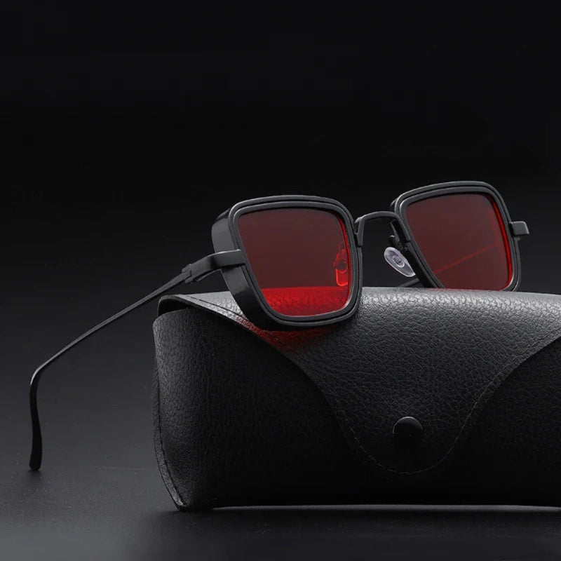Black square sunglasses with red lenses and steel frame on luxury black leather case – Achille Mr. Steel Sunglasses by Polumi.