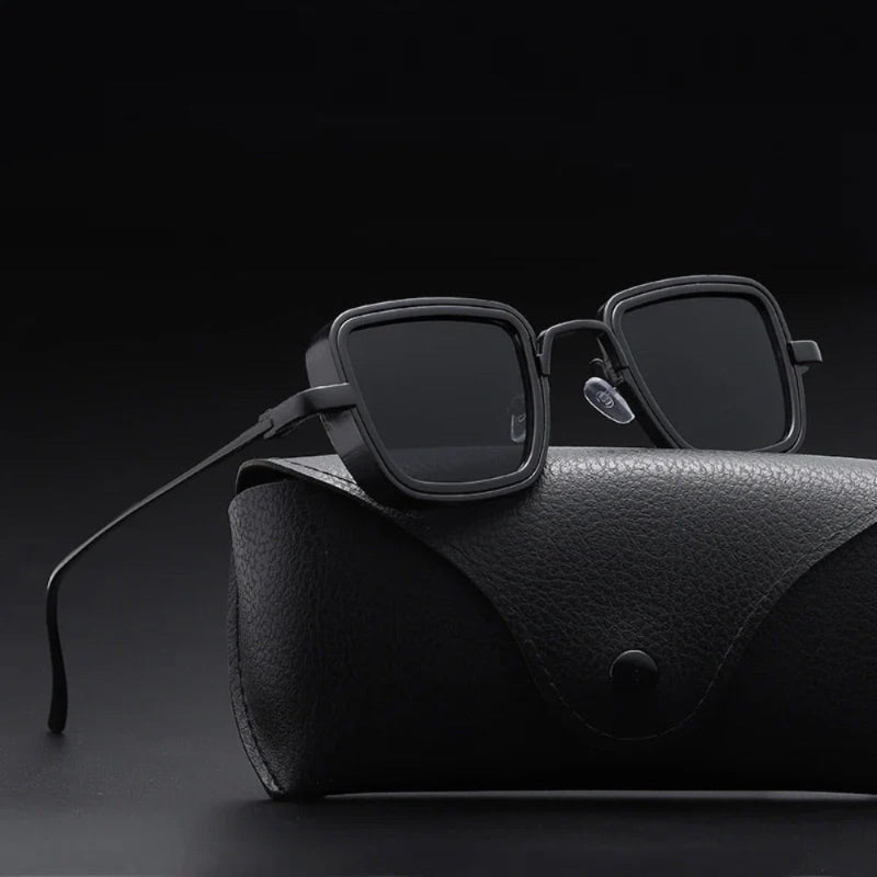 Matte black square sunglasses with dark lenses on leather case – Achille Mr. Steel Sunglasses by Polumi.