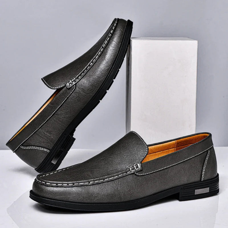 Pair of Aldo Slip On Leather Loafers in gray, elegant men's slip-on shoes blending comfort and craftsmanship by Polumi.
