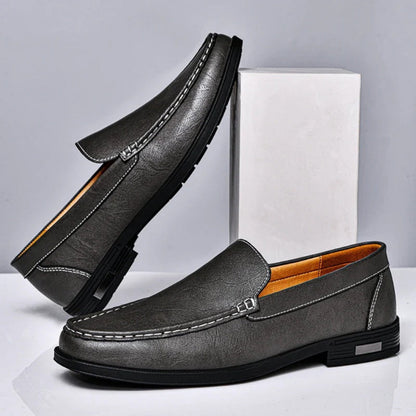 Pair of Aldo Slip On Leather Loafers in gray, elegant men's slip-on shoes blending comfort and craftsmanship by Polumi.