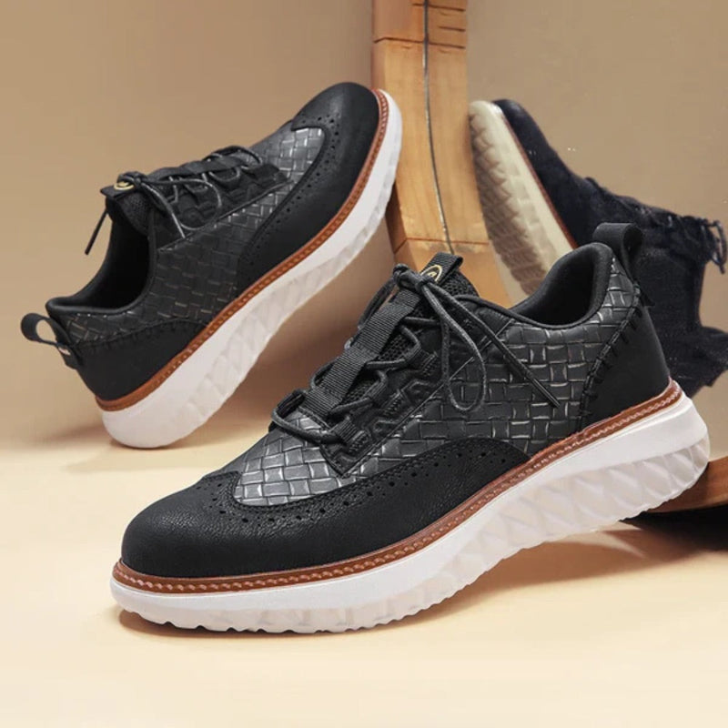 Black Bruno Ridge Leather Sneakers with woven detailing and cushioned white outsole, refined casual men’s footwear