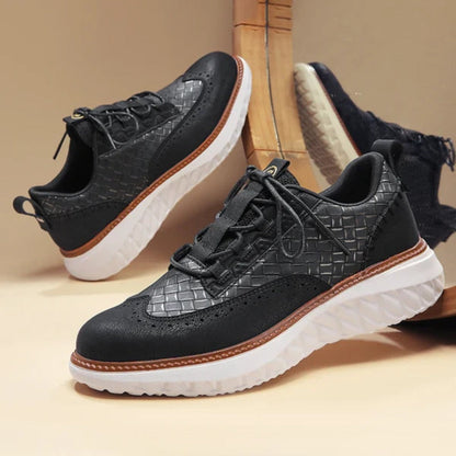 Black Bruno Ridge Leather Sneakers with woven detailing and cushioned white outsole, refined casual men’s footwear