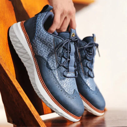 Blue Bruno Ridge Leather Sneakers shown outdoors on wooden step, breathable design with luxury textured leather