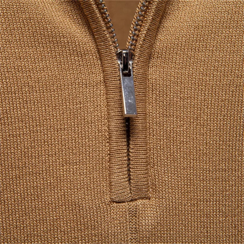 Close-up detail of half zip closure on camel knit polo shirt for men.