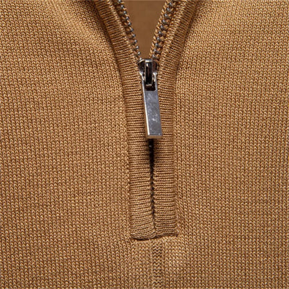 Close-up detail of half zip closure on camel knit polo shirt for men.