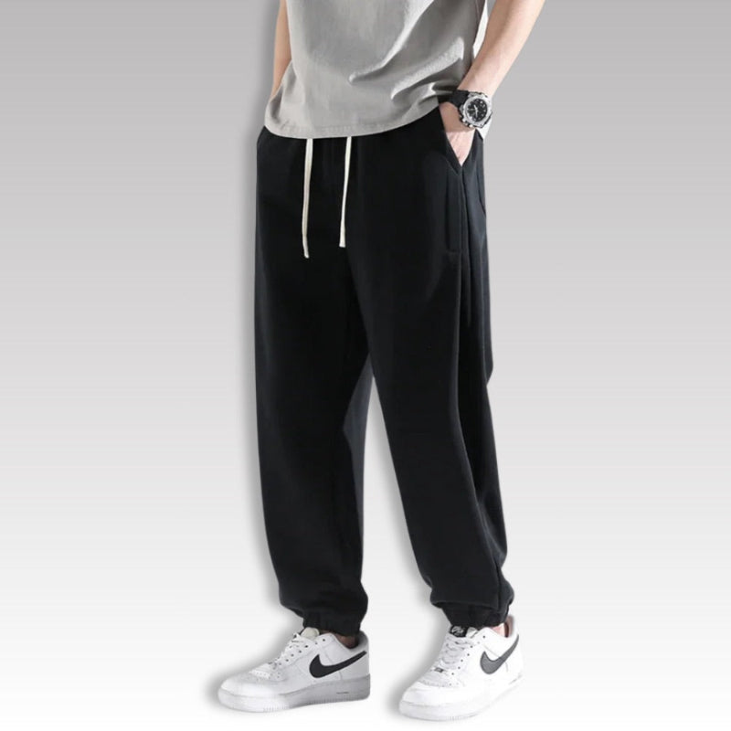 Corrado Premium Joggers in black, modern men’s jogger sweatpants styled with white sneakers.