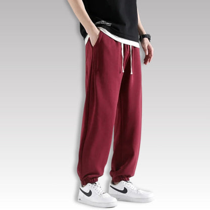 Corrado Premium Joggers in red color, relaxed fit men’s sweatpants with drawstring waist and elastic cuffs.