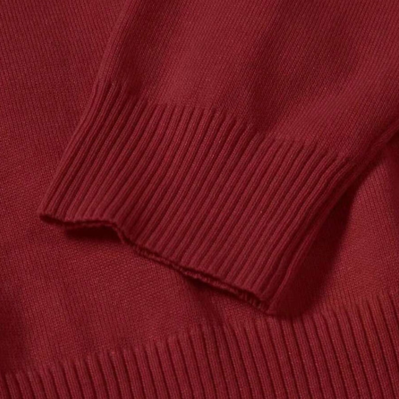 Detailed sleeve of Purpura Red Dario Luxe Turtleneck Sweater – fine knit texture and ribbed finish by Polumi.