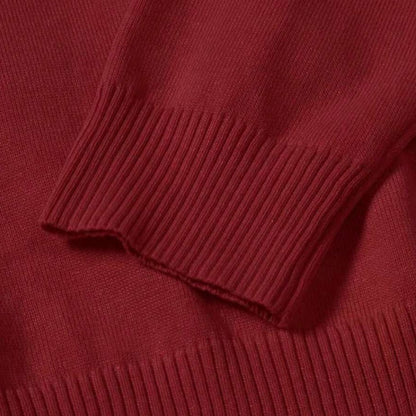 Detailed sleeve of Purpura Red Dario Luxe Turtleneck Sweater – fine knit texture and ribbed finish by Polumi.