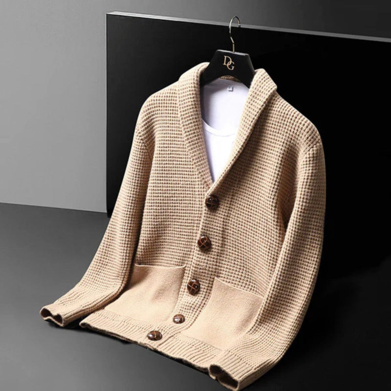 Angled view of the Domenico Cable Wool Cardigan in beige – men’s luxury cardigan featuring shawl collar and modern waffle knit by Polumi.