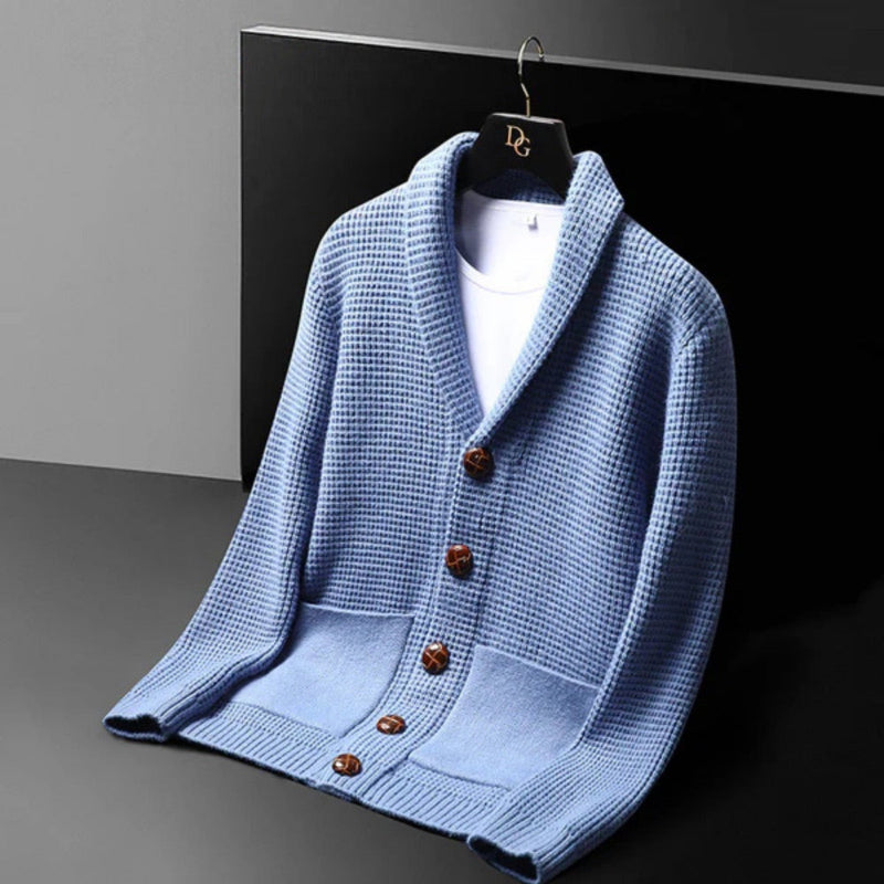 Angled view of the Domenico Cable Wool Cardigan in blue – stylish men’s knit cardigan with front buttons and waffle pattern by Polumi.