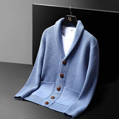 Angled view of the Domenico Cable Wool Cardigan in blue – stylish men’s knit cardigan with front buttons and waffle pattern by Polumi.